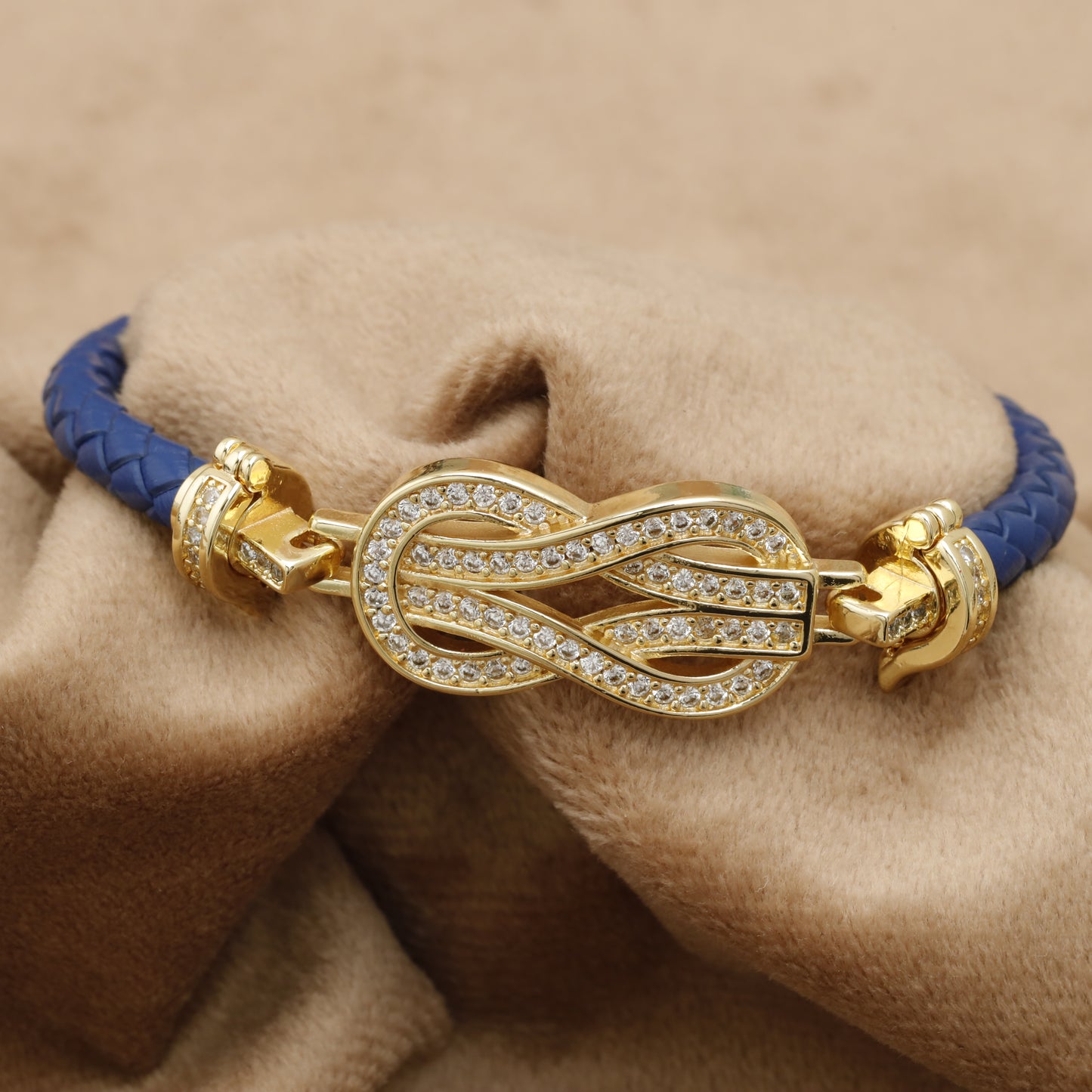 Blue Braided Leather Bracelet – Gold Crystal Infinity Knot Clasp | KAR43